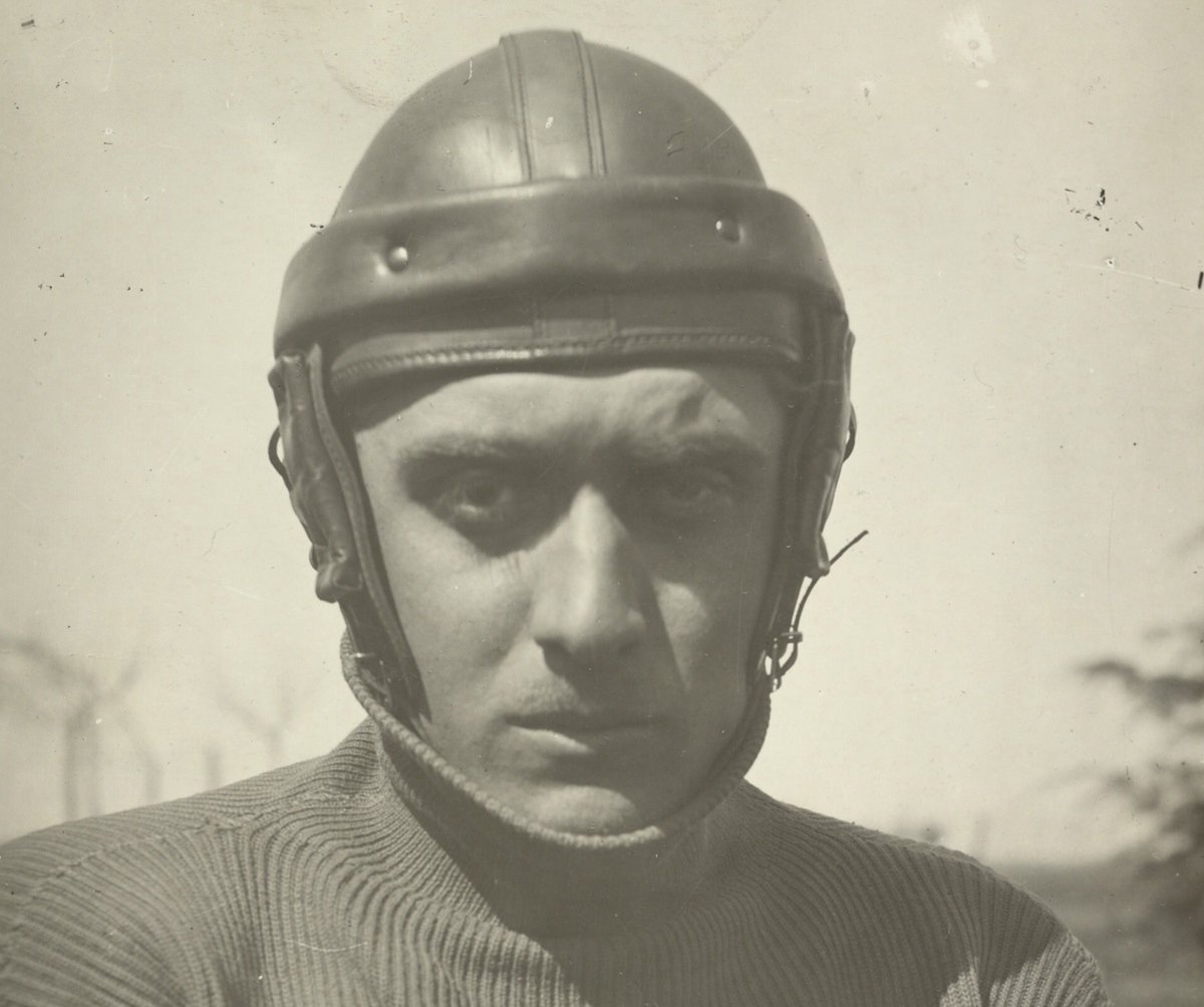 A man in a safety helmet looks concerned